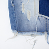New denim shorts with torn fabric