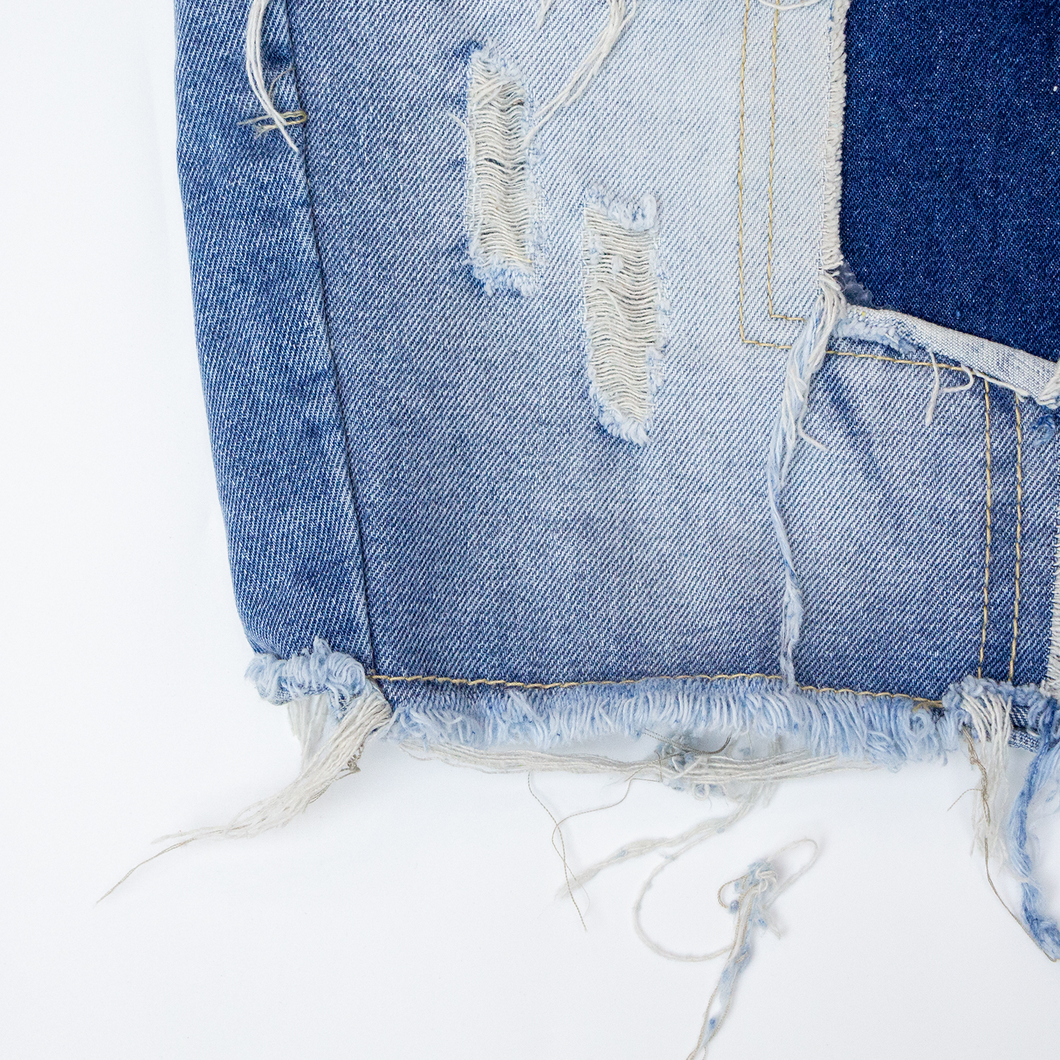New denim shorts with torn fabric
