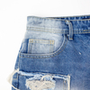 New denim shorts with torn fabric