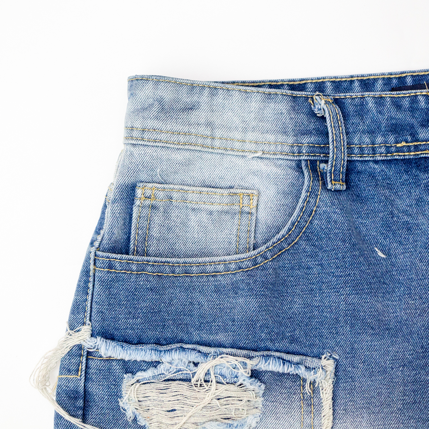 New denim shorts with torn fabric