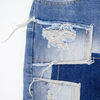 New denim shorts with torn fabric