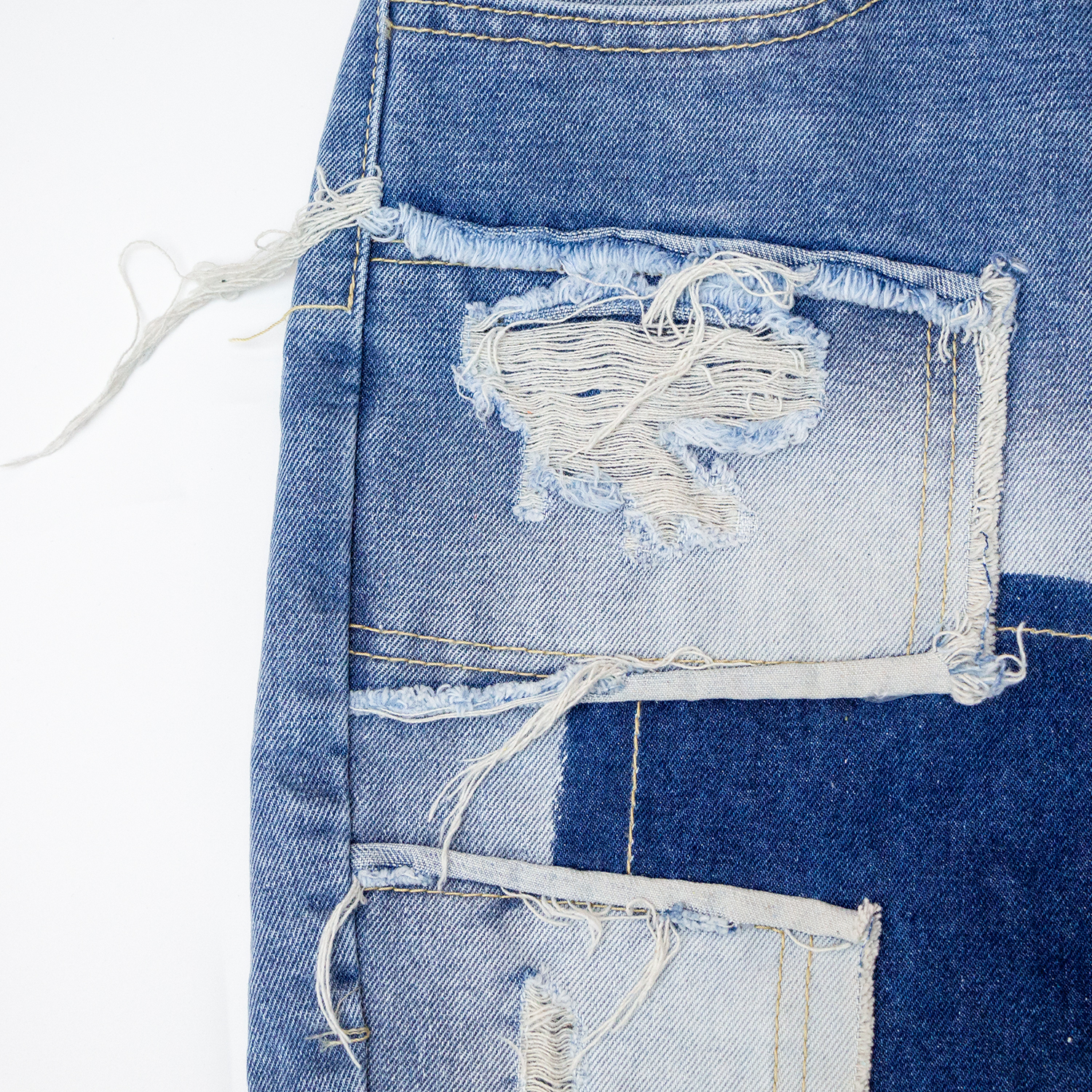 New denim shorts with torn fabric
